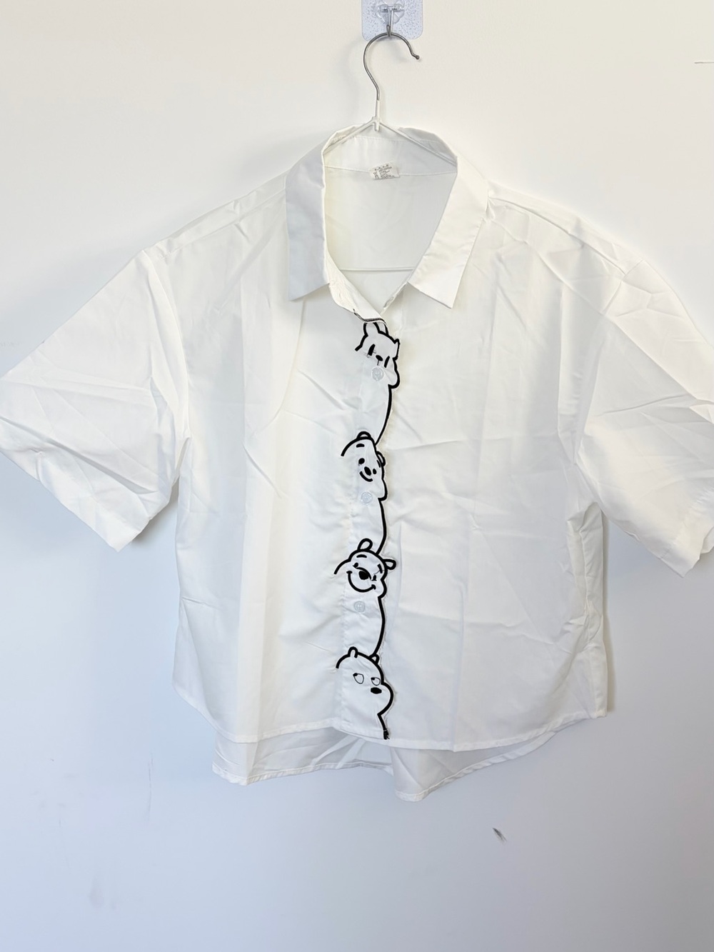 White Short-Sleeve Button-Front Shirt with Playful Embroidery